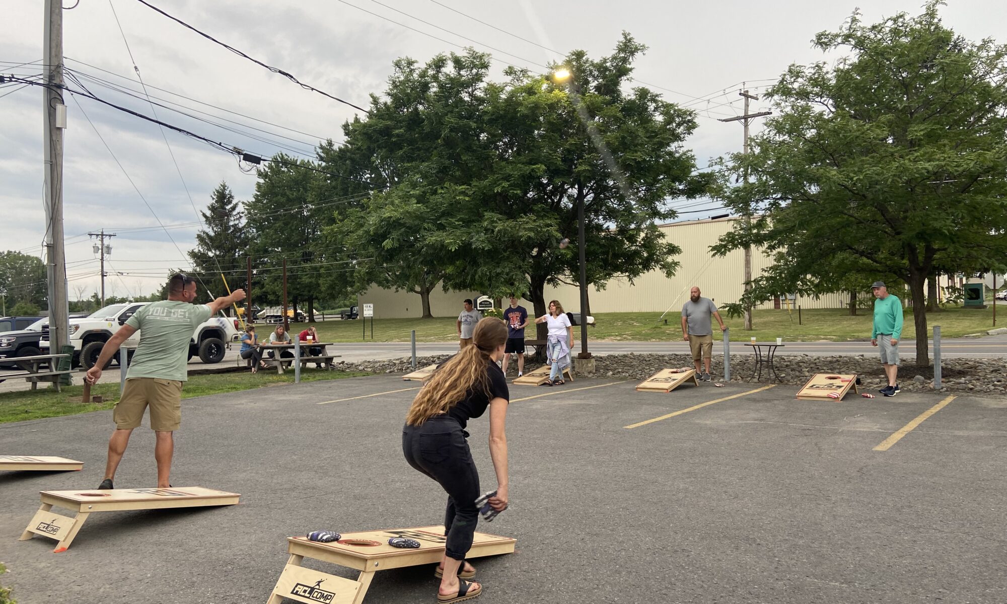 Cornhole players competing at Trapper's Pizza Pub's summer cornhole league.